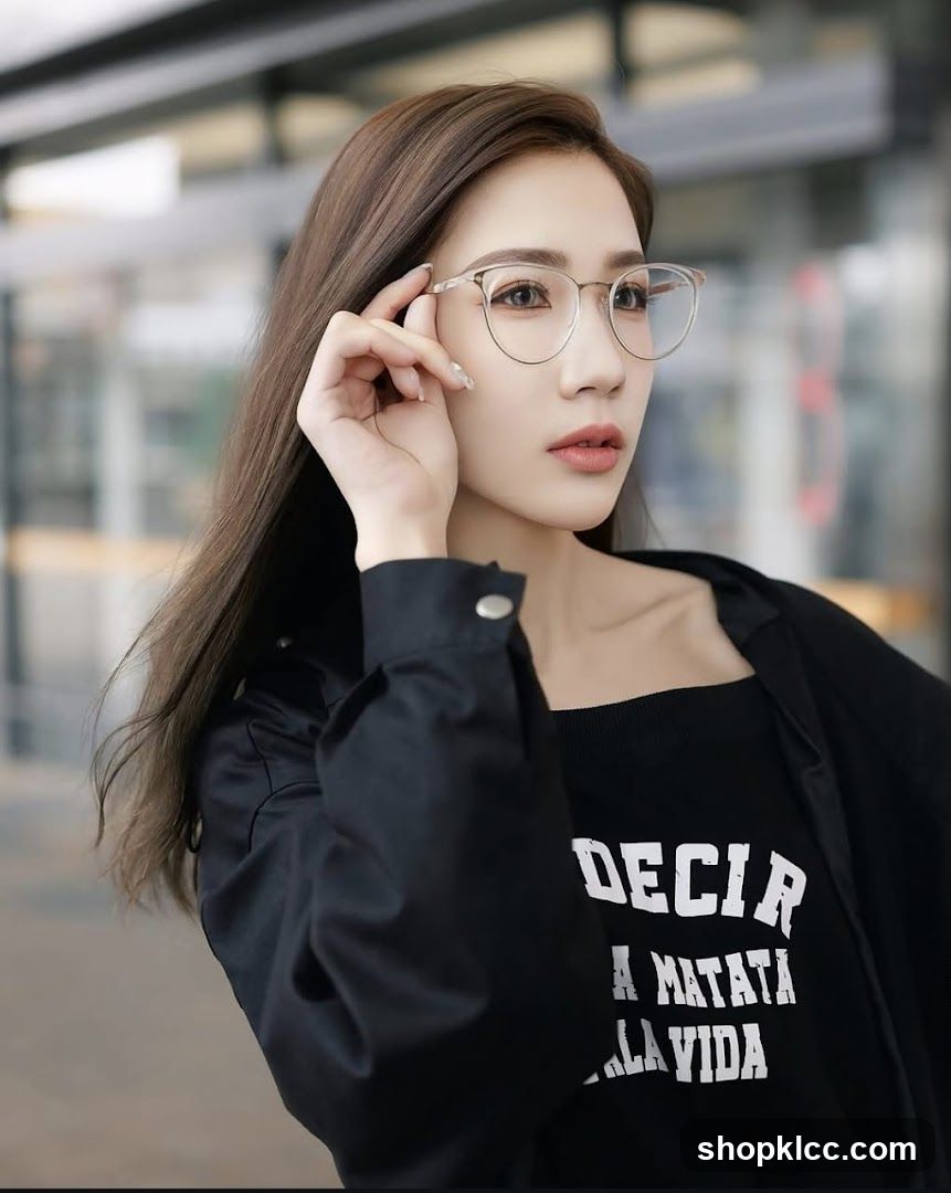 Woman with glasses and black shirt