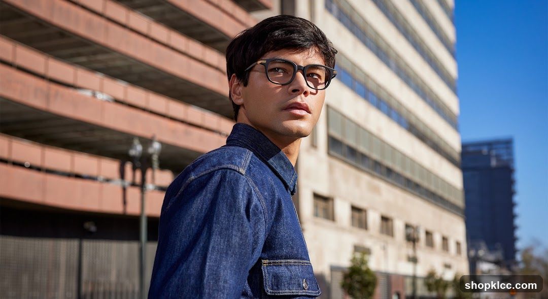 Man in Denim Jacket Outside Building