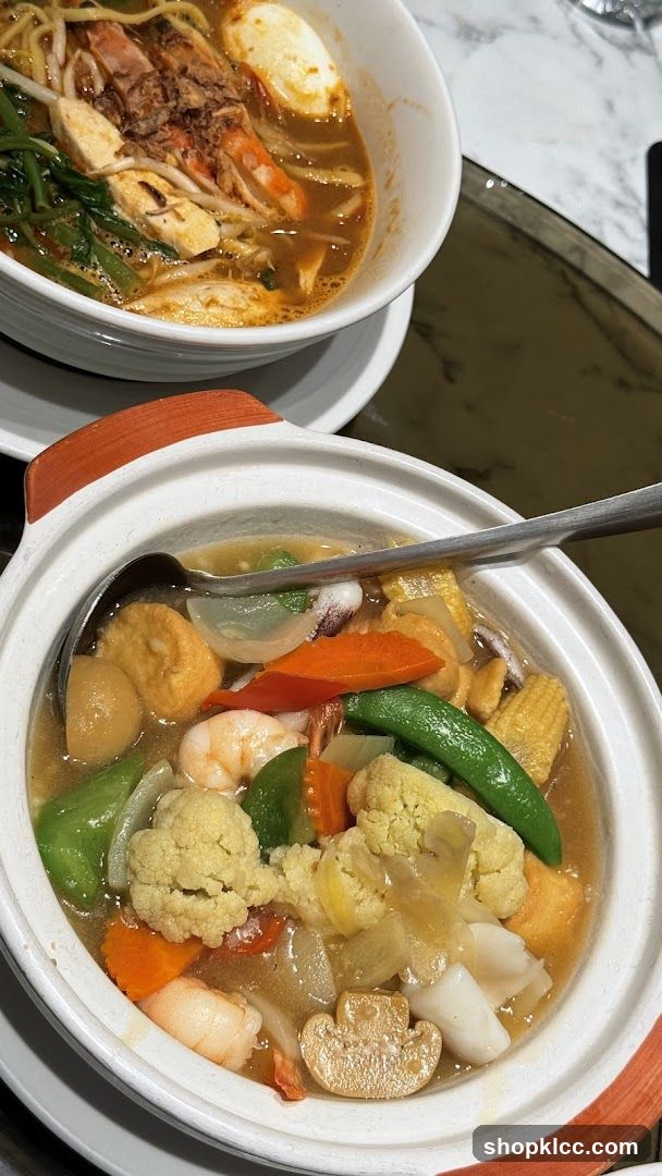Two Bowls of Asian Noodle Soup and Stir-fry