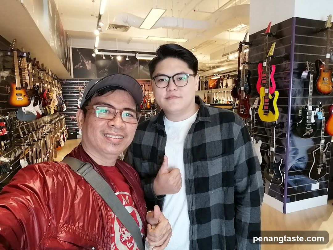 Two Men in a Guitar Store
