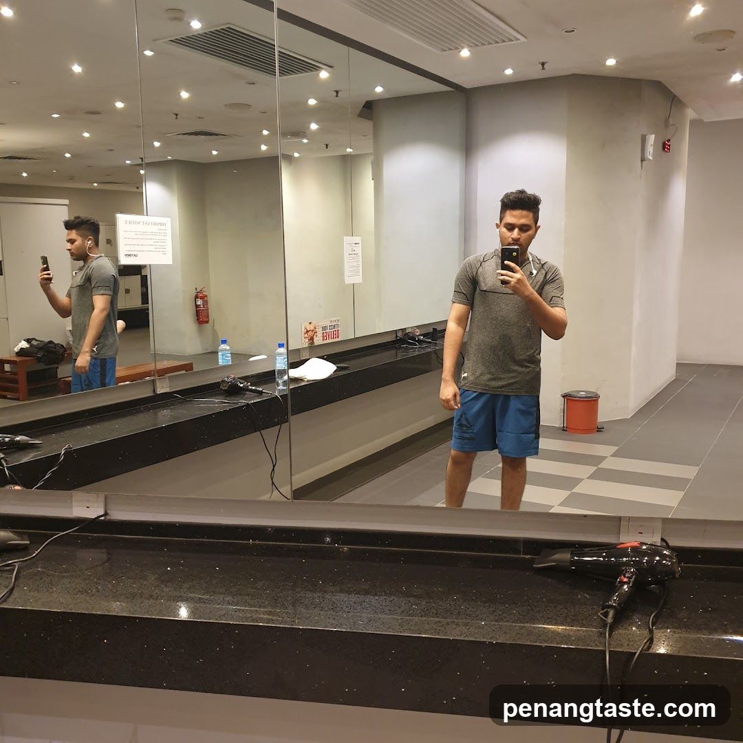 Man taking a selfie in a gym locker room