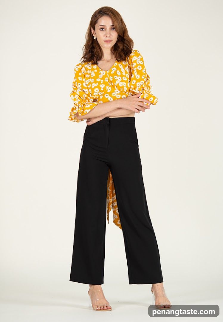 Woman in Yellow Floral Top and Black Wide-Leg Pants