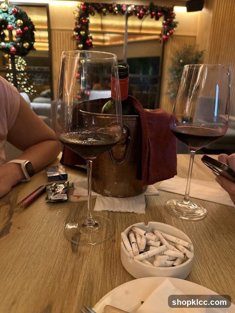 Table setting with wine and cigarettes