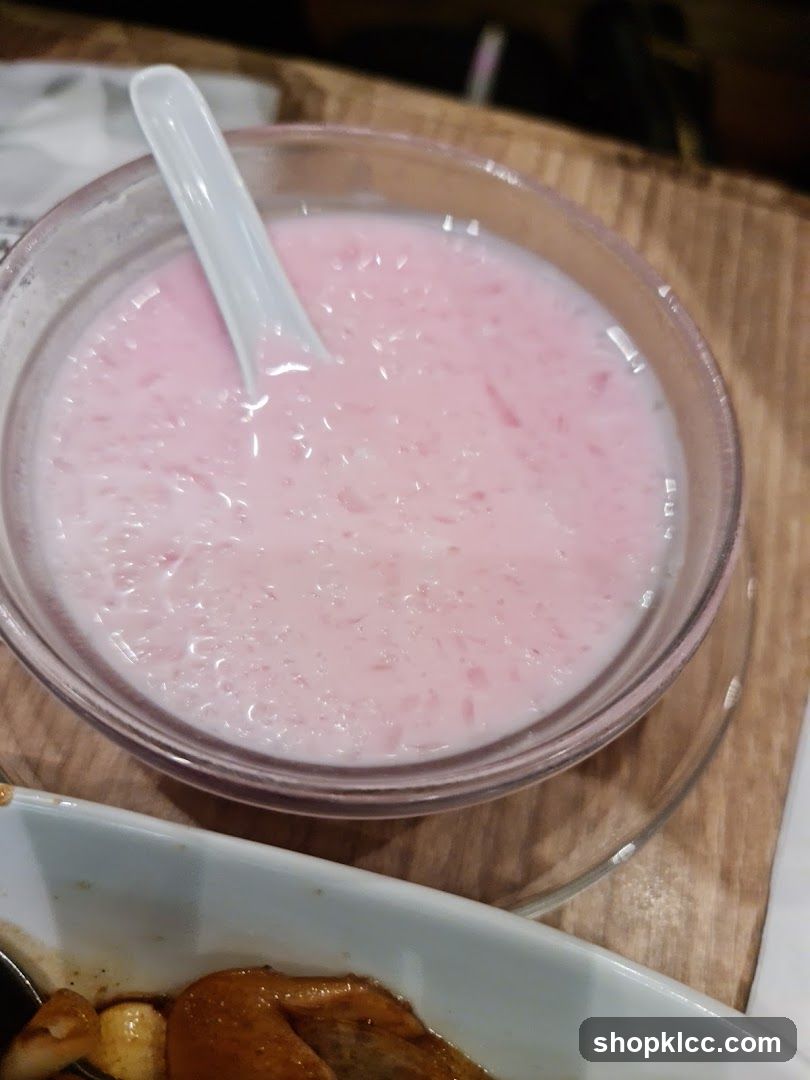 Pink dessert with spoon