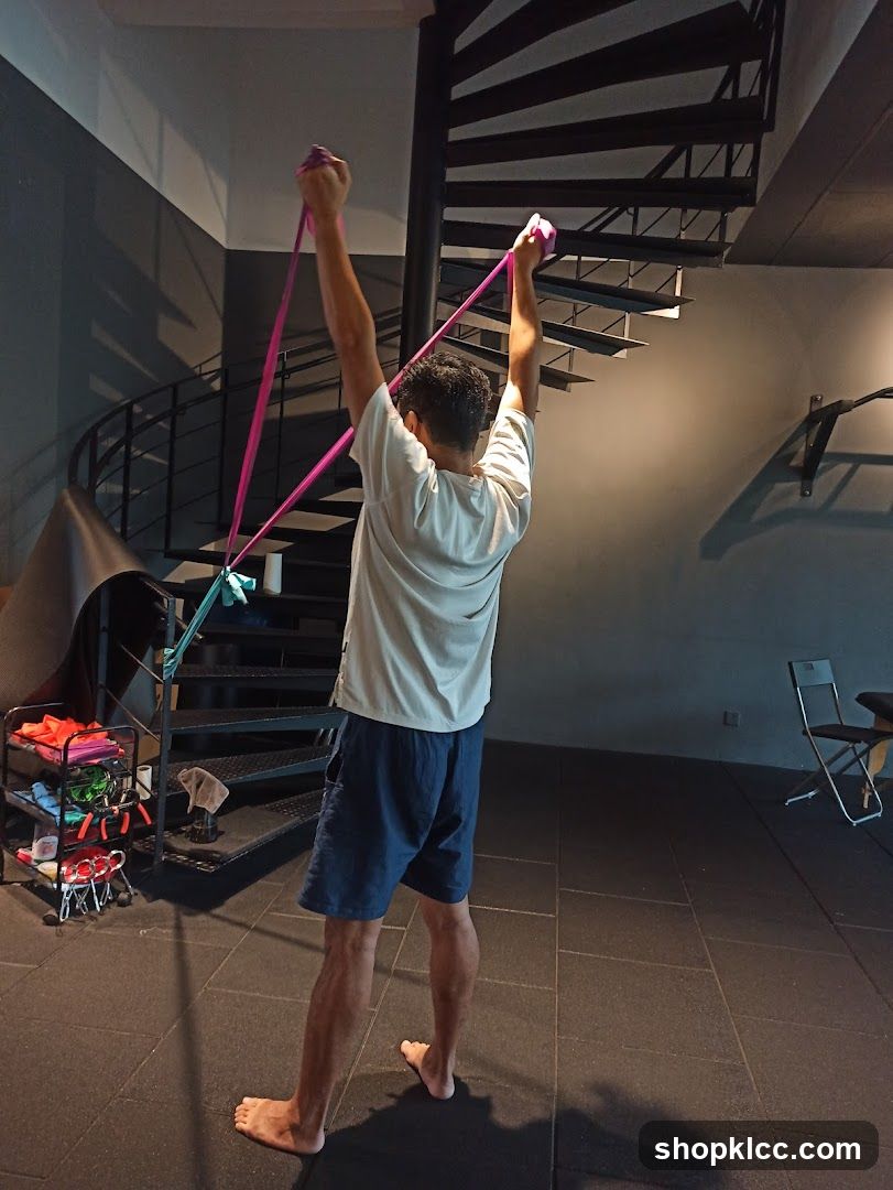 Man exercising with resistance bands