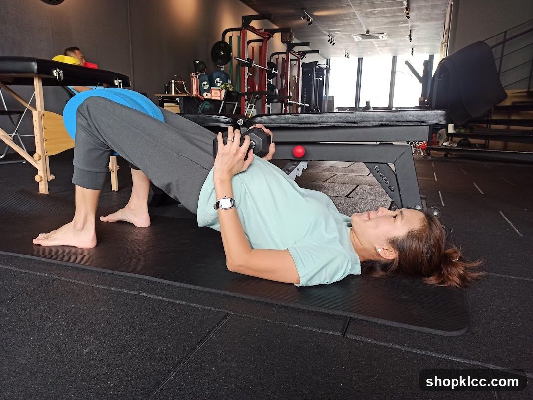 Woman performing a glute bridge exercise