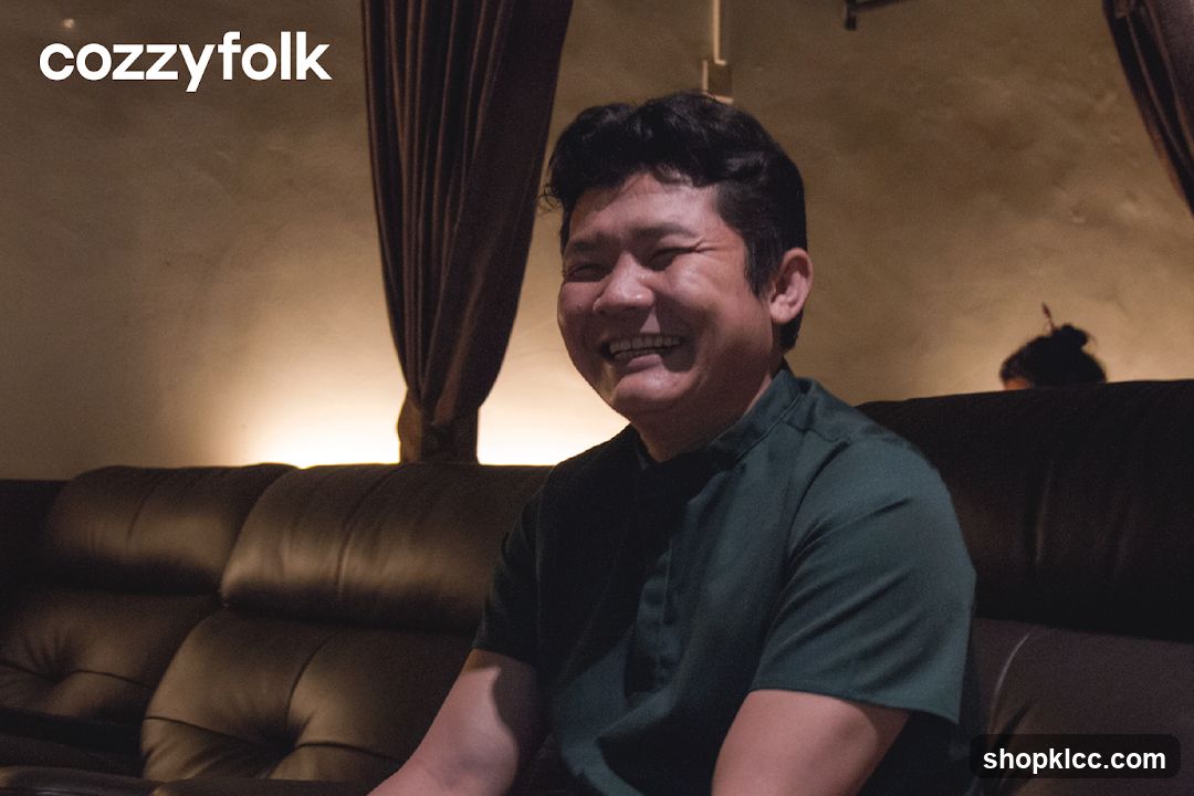 Man smiling on a couch