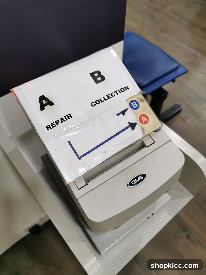 Labelled collection box on a printer