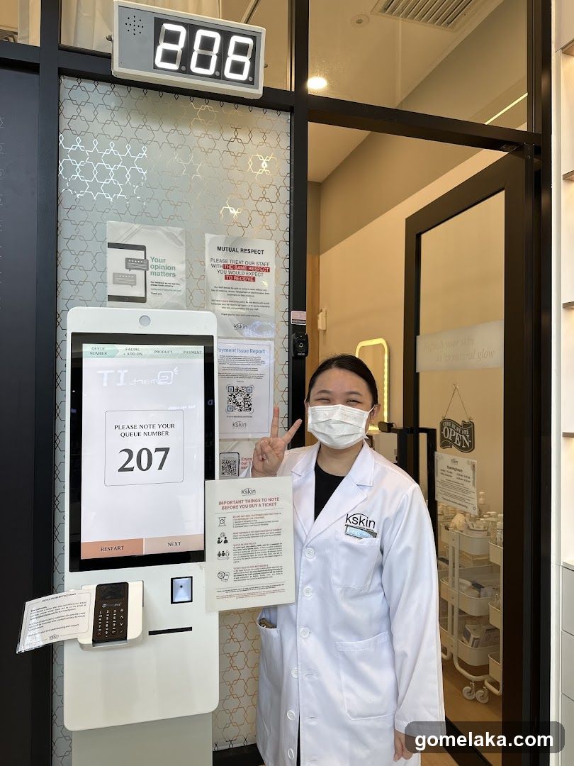 kskin staff at queue kiosk