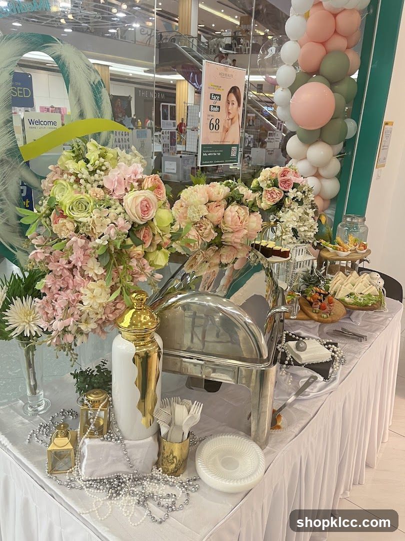 Decorated Buffet Table with Floral Arrangements and Balloons