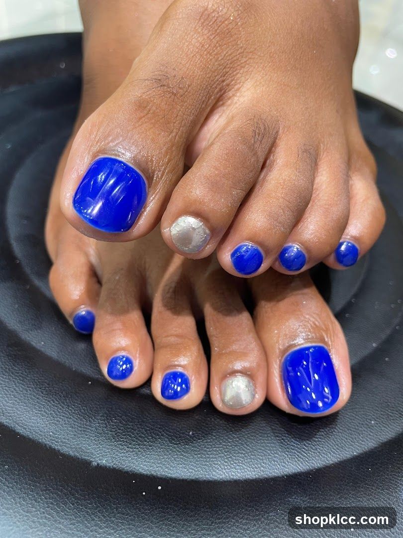 Toes with Blue and Silver Nail Polish