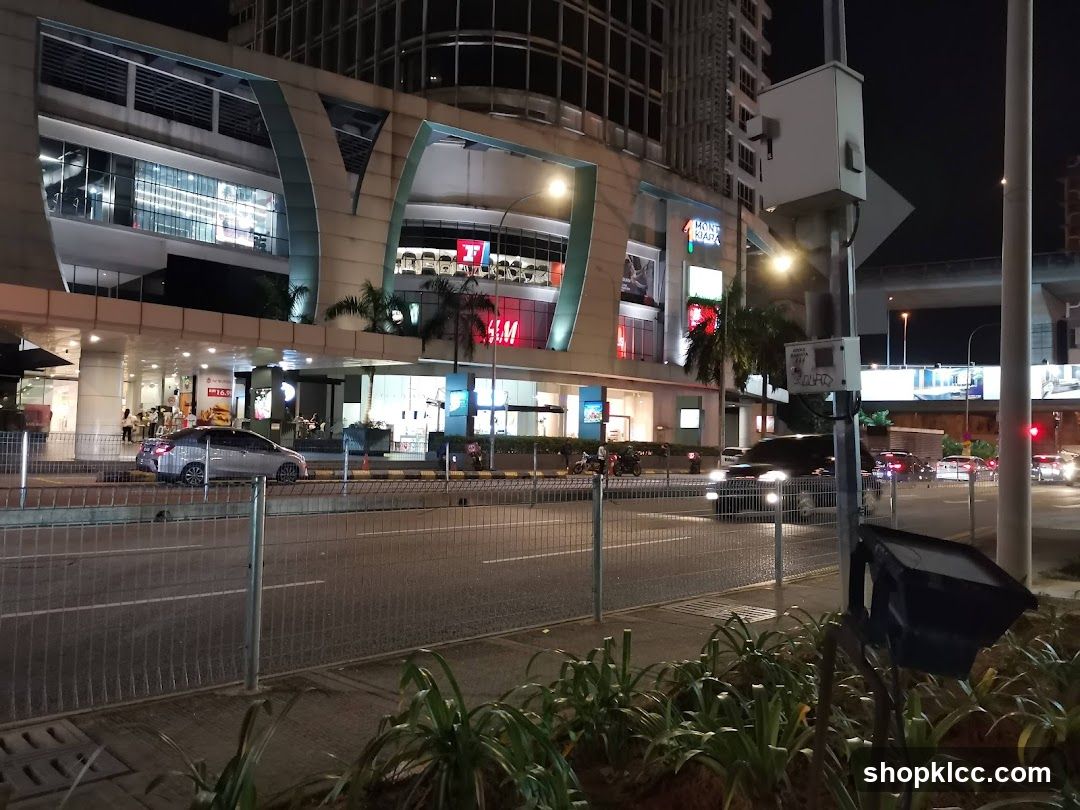 Night street scene with shopping mall exterior