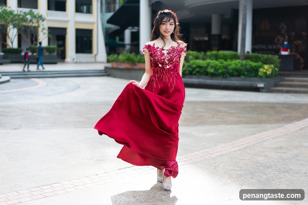Woman in Red Dress Posing Outdoors