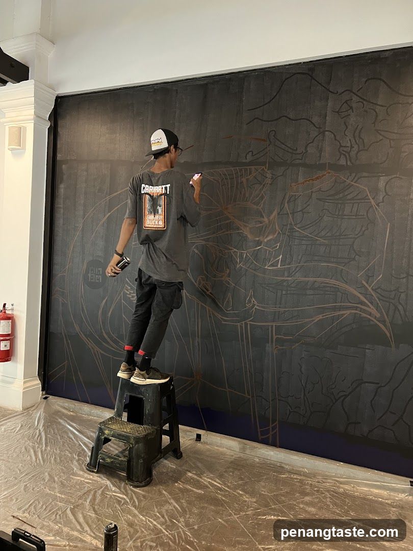 Artist painting a mural