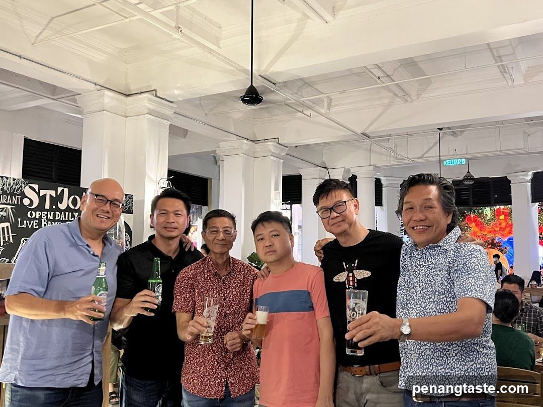 Group of men holding drinks