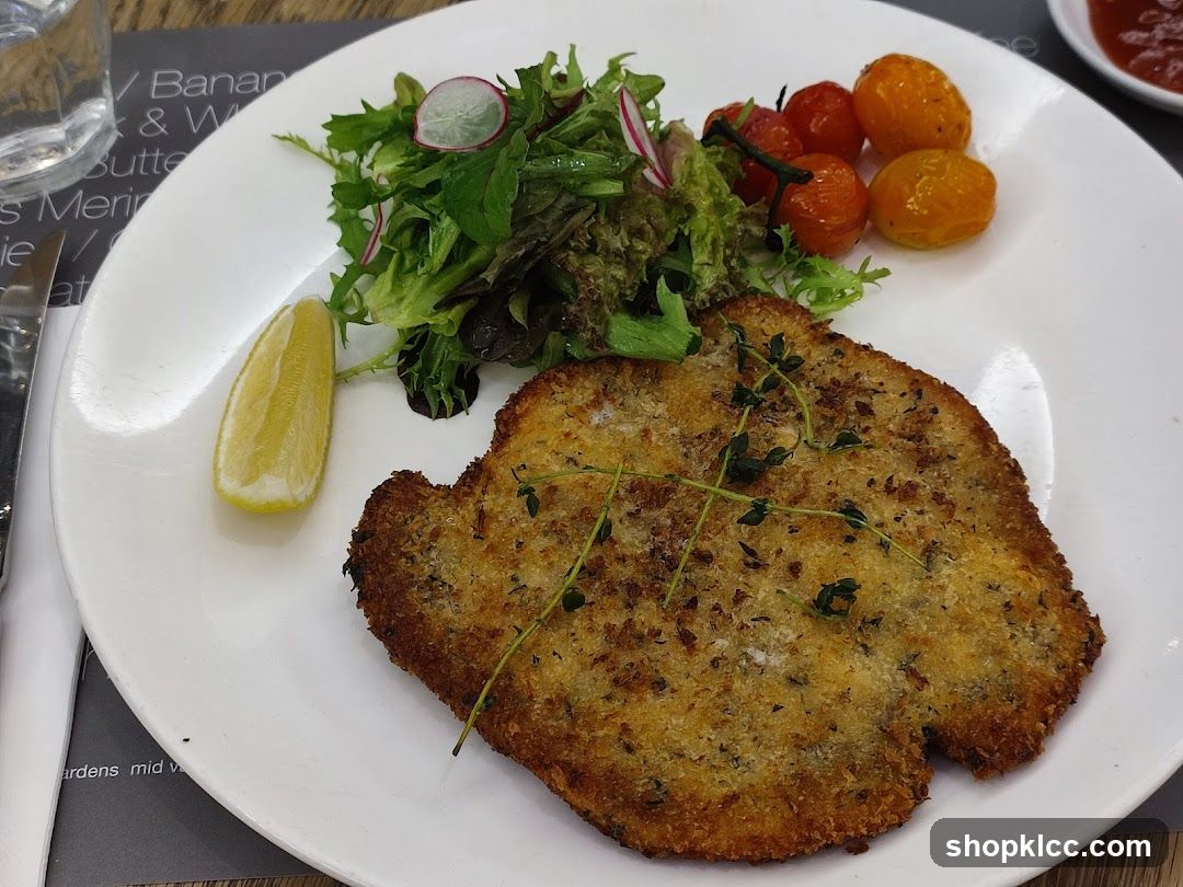 Breaded Cutlet with Salad and Tomatoes