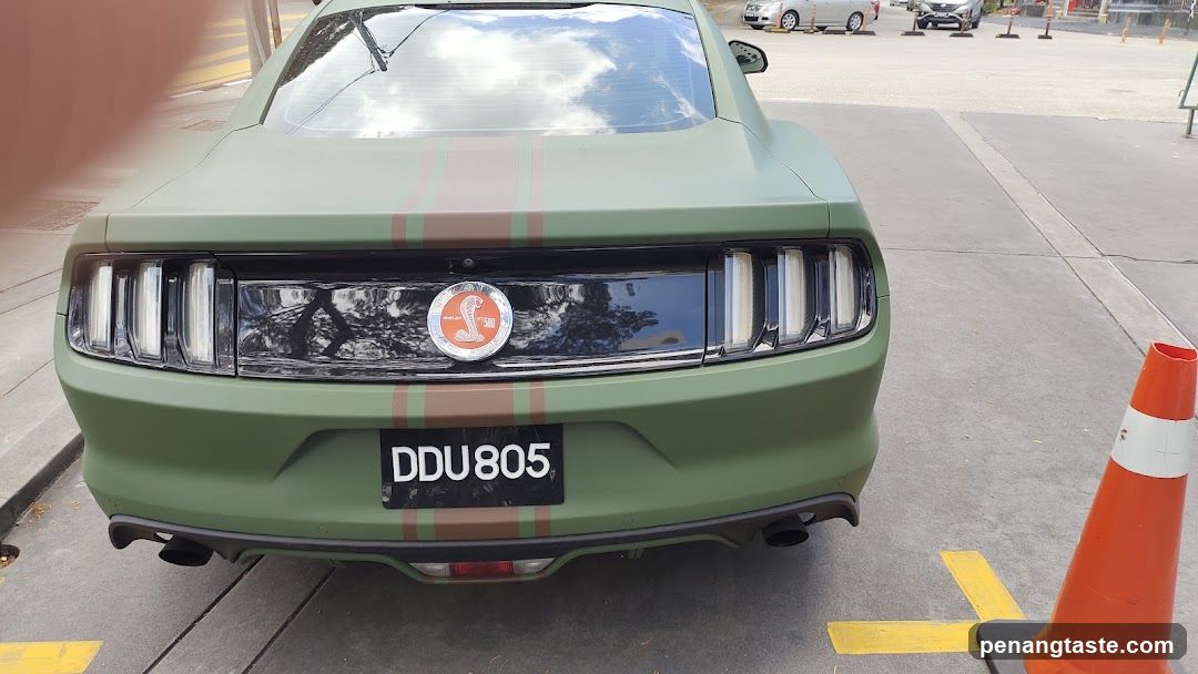 Green Mustang with Cobra Emblem