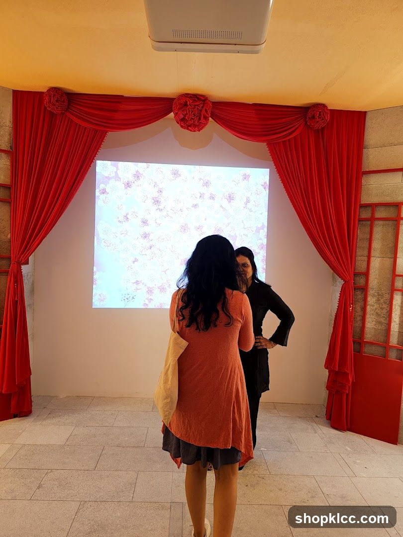 Two women in front of a projected image