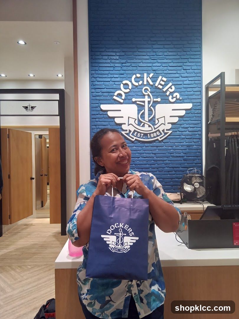 Woman holding a Dockers shopping bag