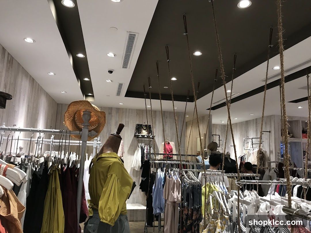 Clothing store interior with mannequins and racks of clothes