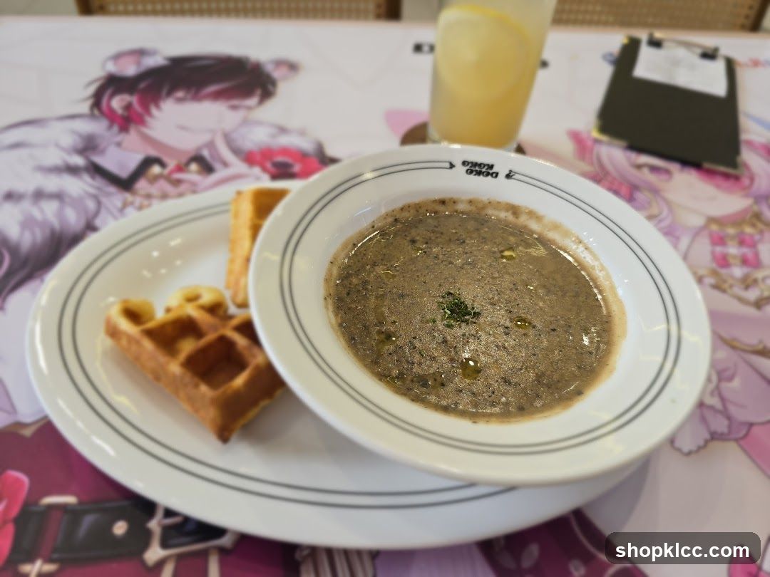 Anime-themed table setting with soup and waffles