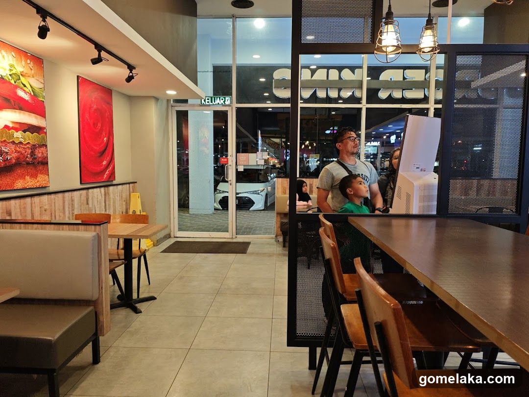 Restaurant Interior with Customers at Counter