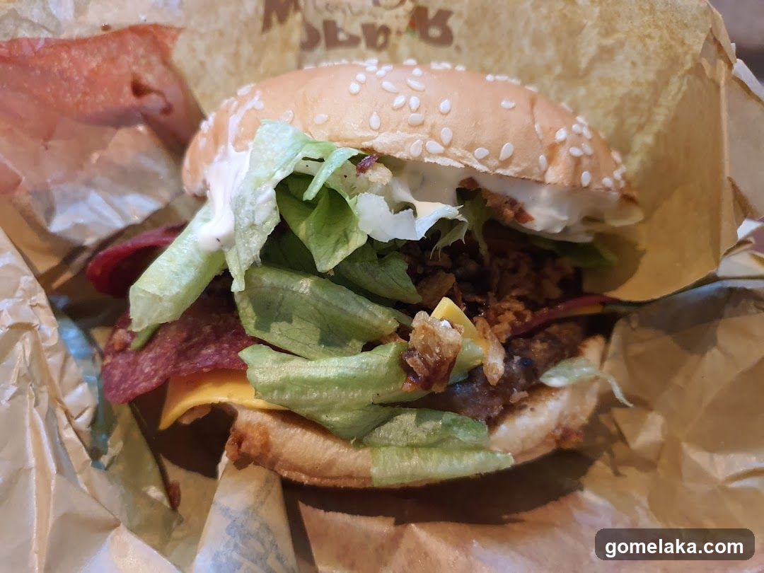 Burger in paper wrapper