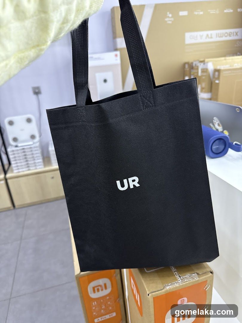 Black tote bag with 'UR' logo