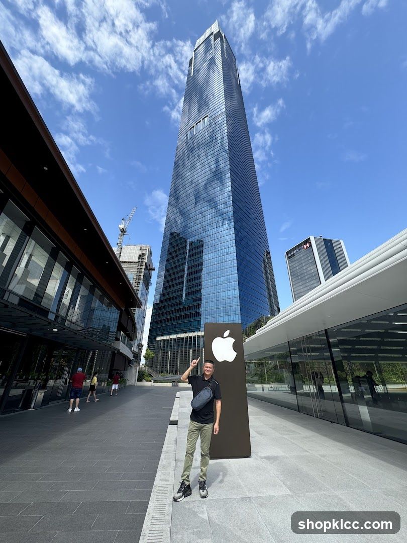 Man Posing by Apple Store Entrance