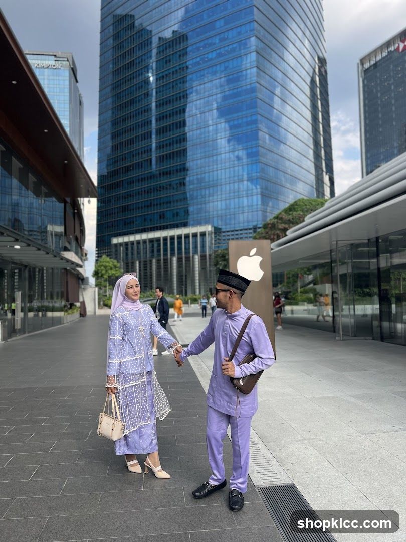 Couple Posing in Front of Modern Buildings