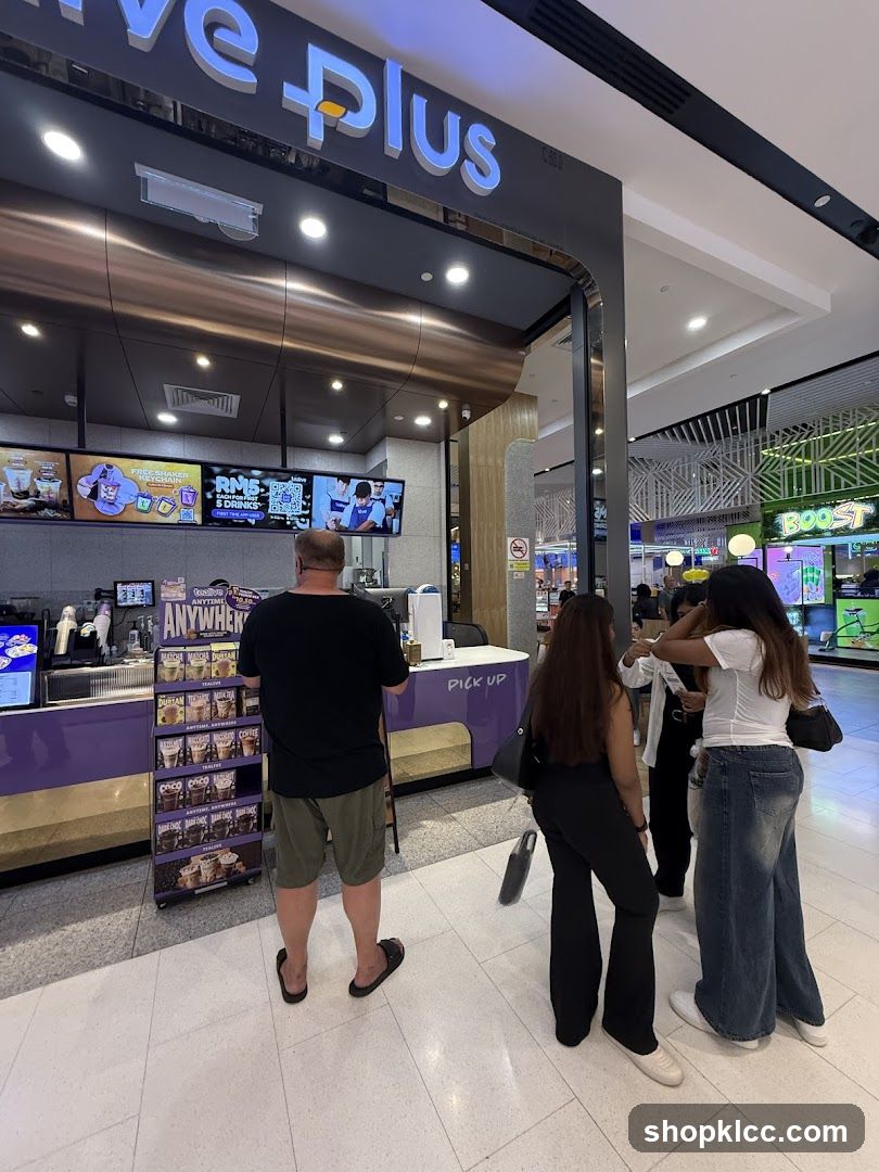 People ordering at a cafe counter