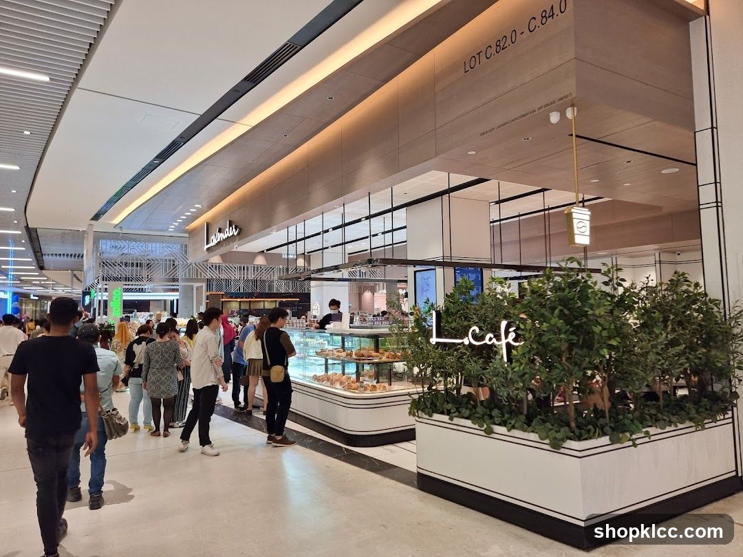 Cafe interior with display cases and seating area
