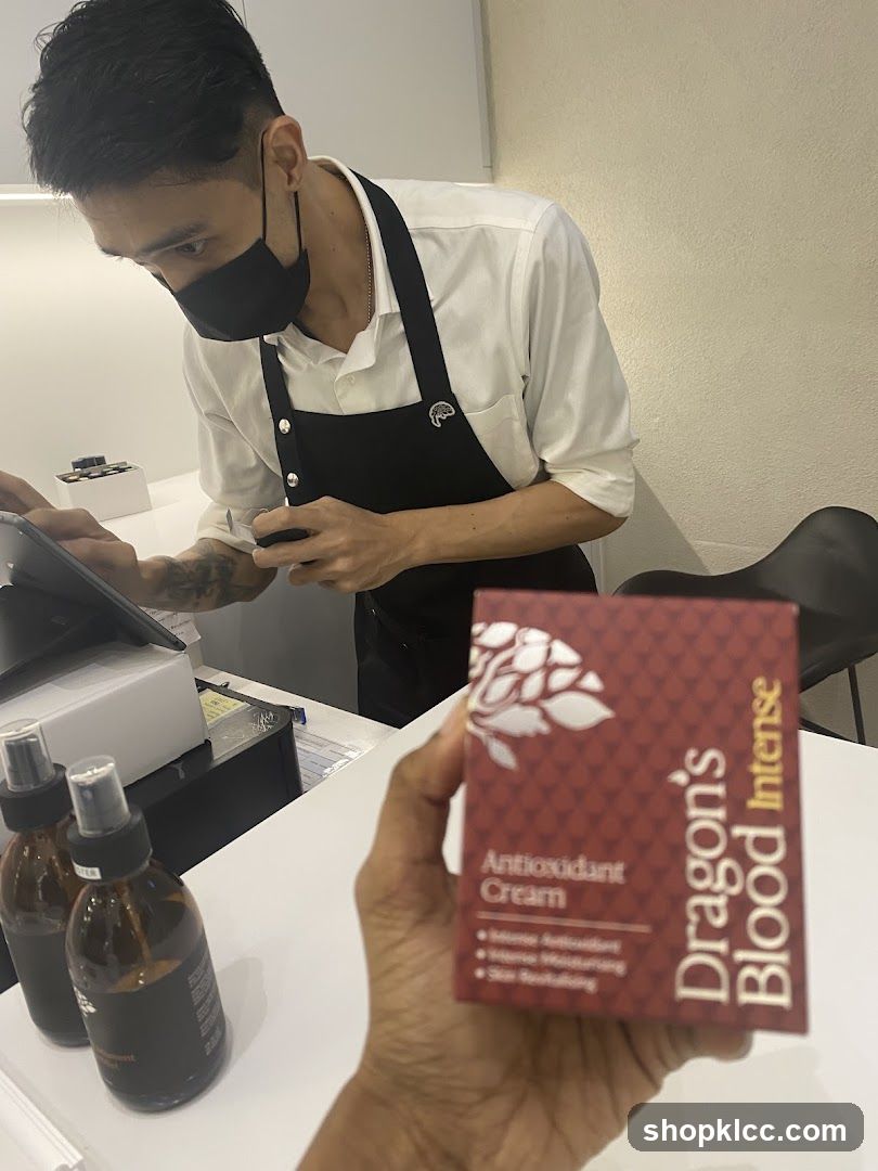 Person holding a box of Dragon's Blood Intense Antioxidant Cream