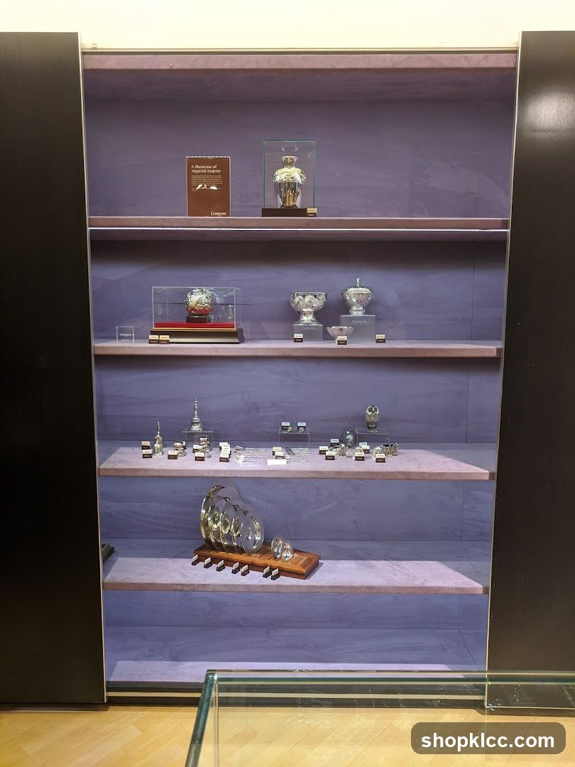 Display case with ornate silver items