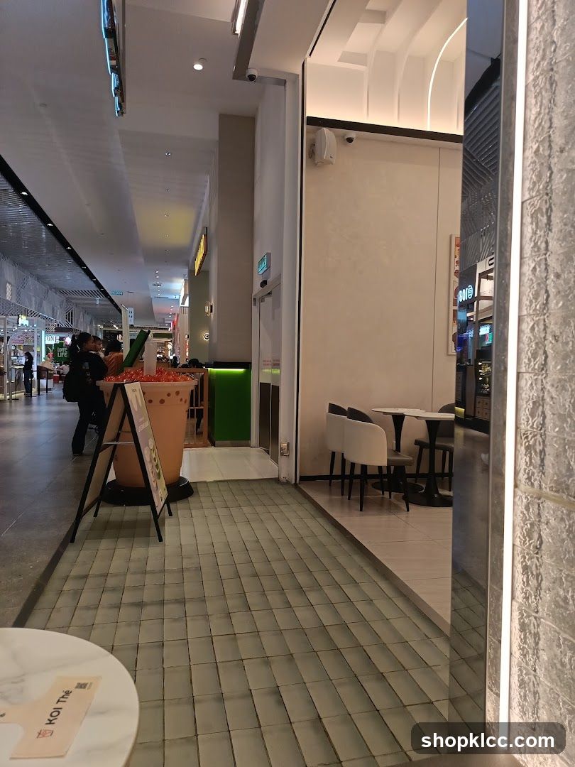 Indoor mall walkway with a bubble tea shop