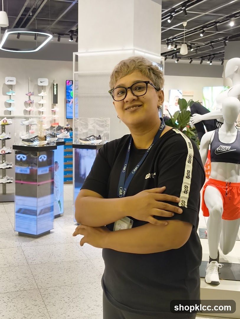 Store employee in athletic wear store