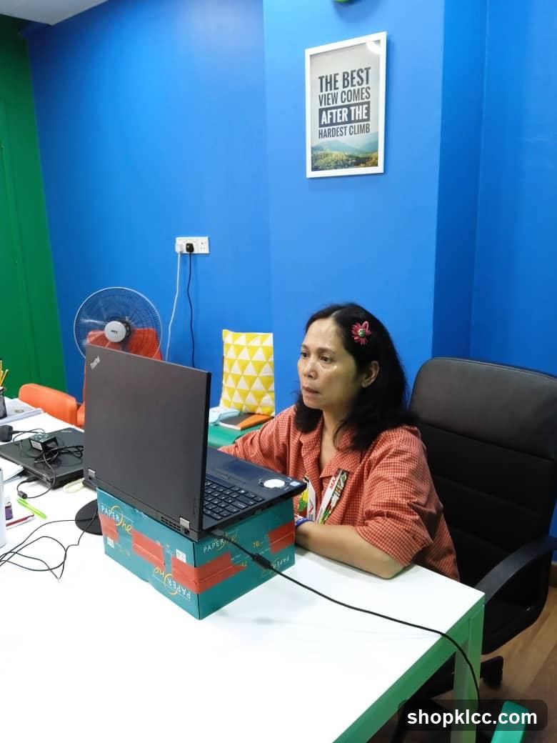 Office Workspace with Laptop on Box