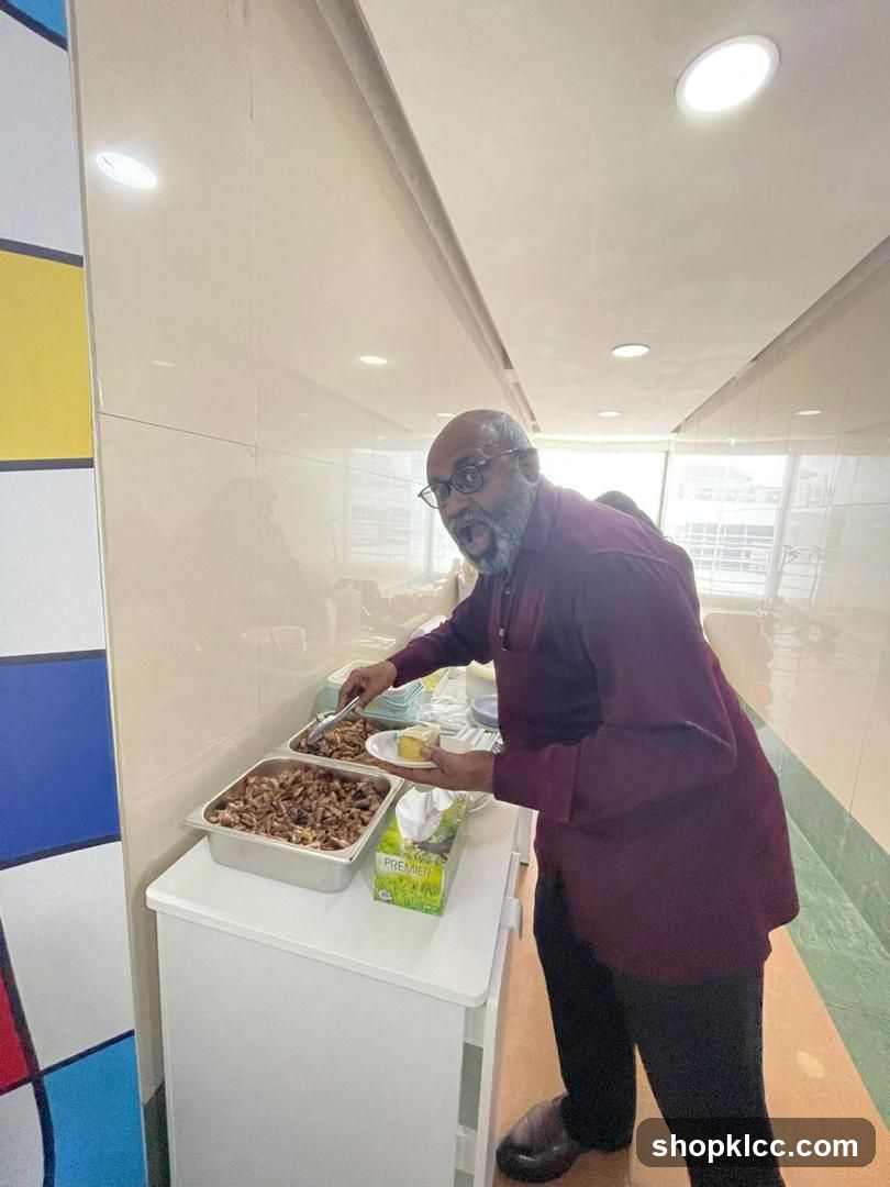 Man Serving Food at Buffet