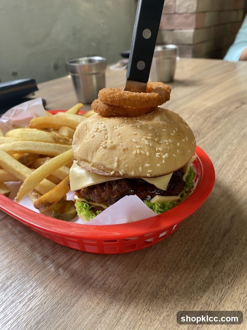 Burger with Onion Rings and Fries