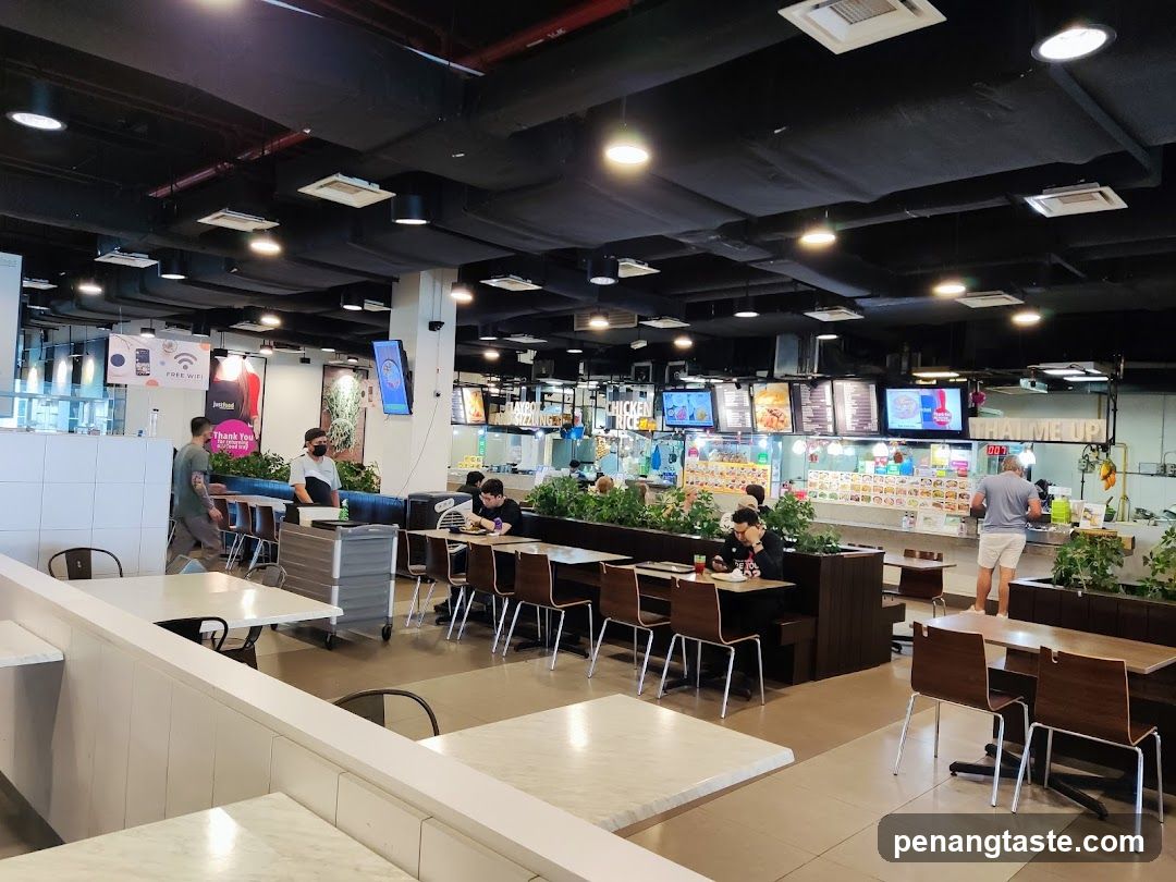 Food court with multiple stalls and seating areas