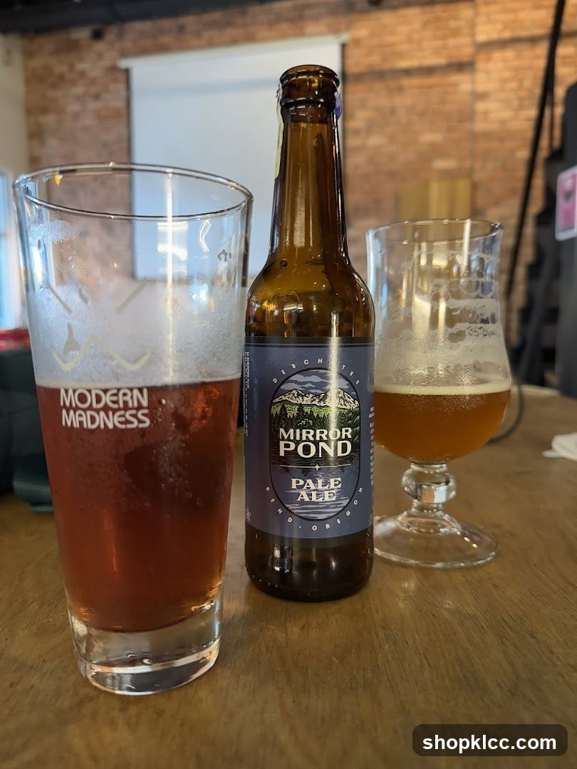 Two glasses of beer and a bottle of pale ale