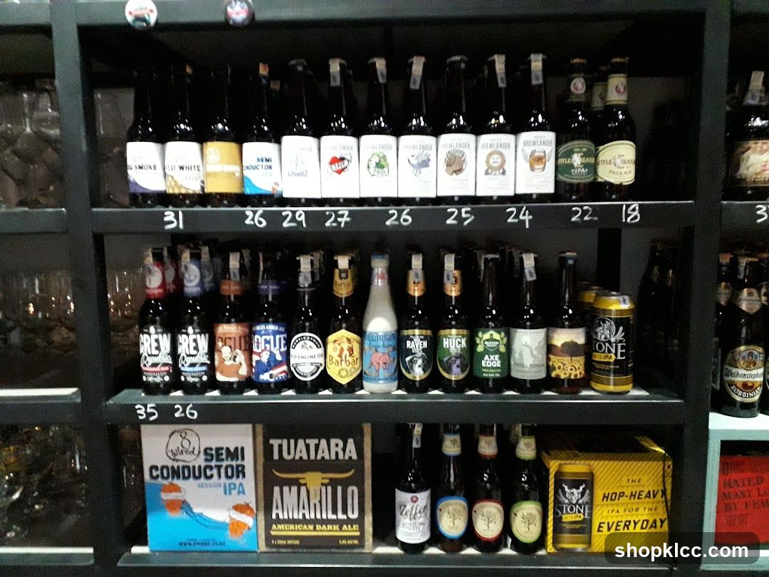 Bottles and cans of beer on shelves