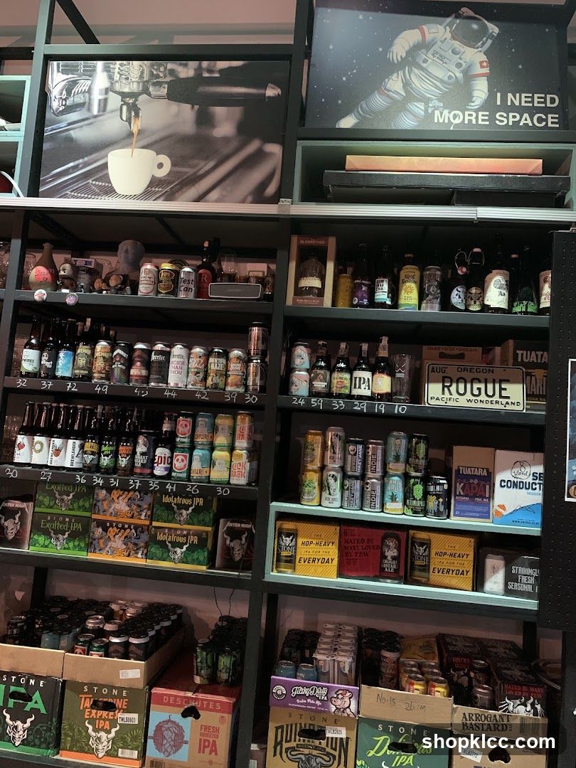 Shelves stocked with beverages and artwork