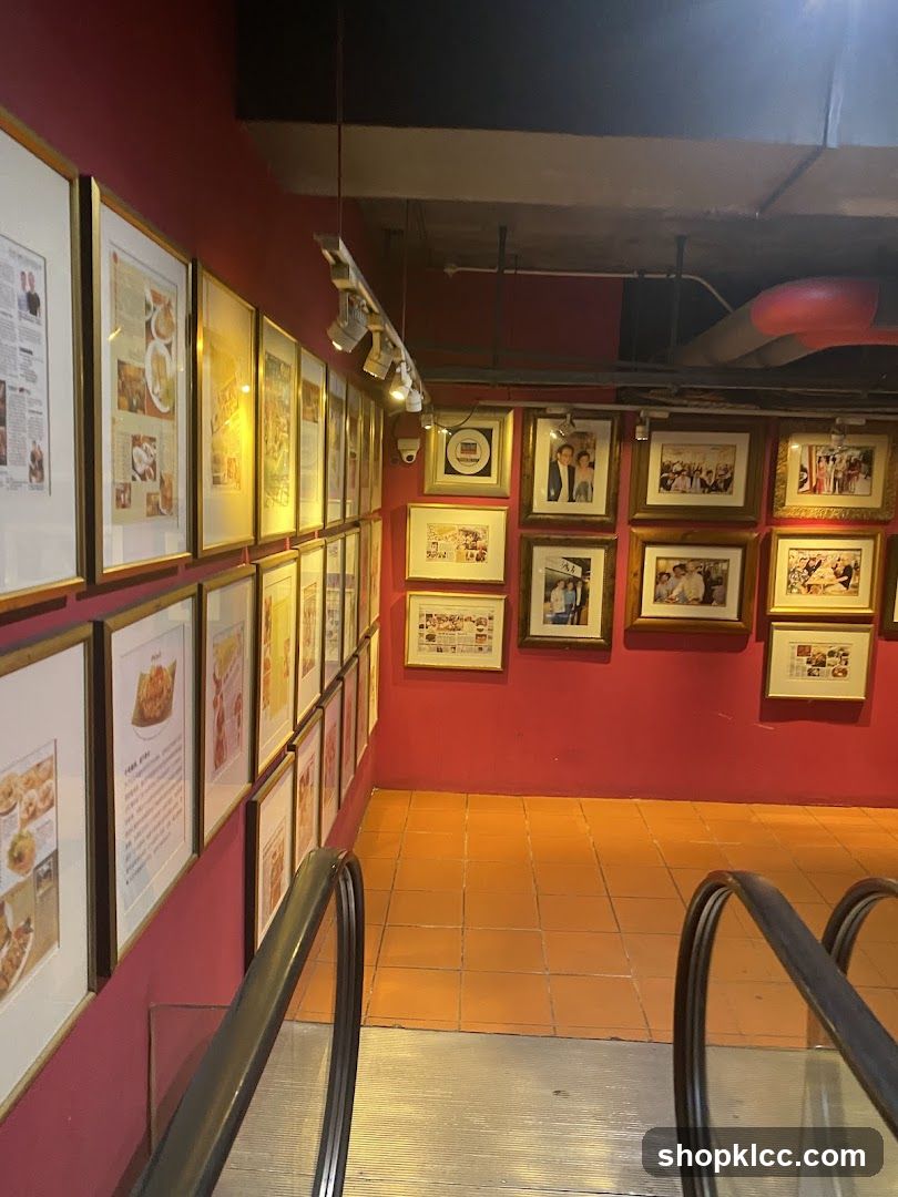 Framed Photos and Articles on a Pink Wall