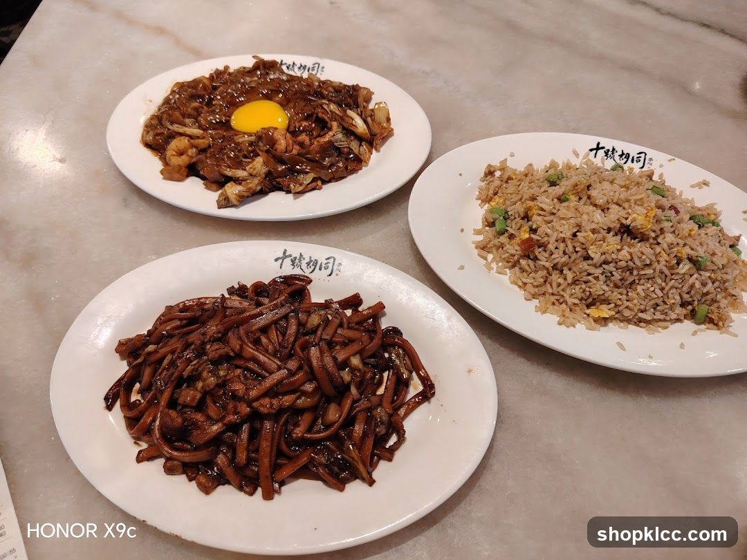 Three Plates of Noodles and Fried Rice