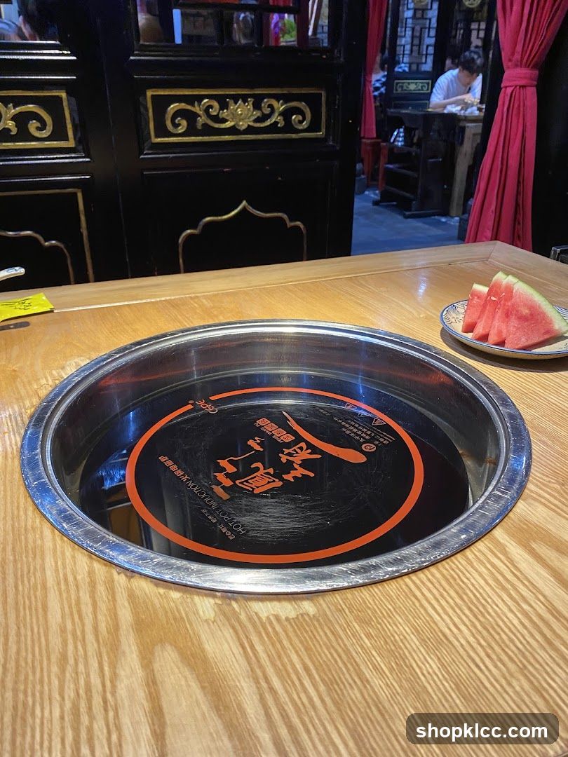 Table Setting with Hot Pot and Watermelon
