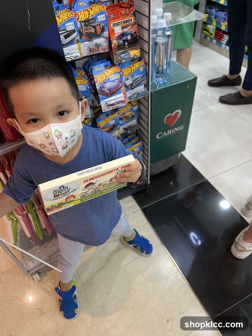 Boy holding a box of toys