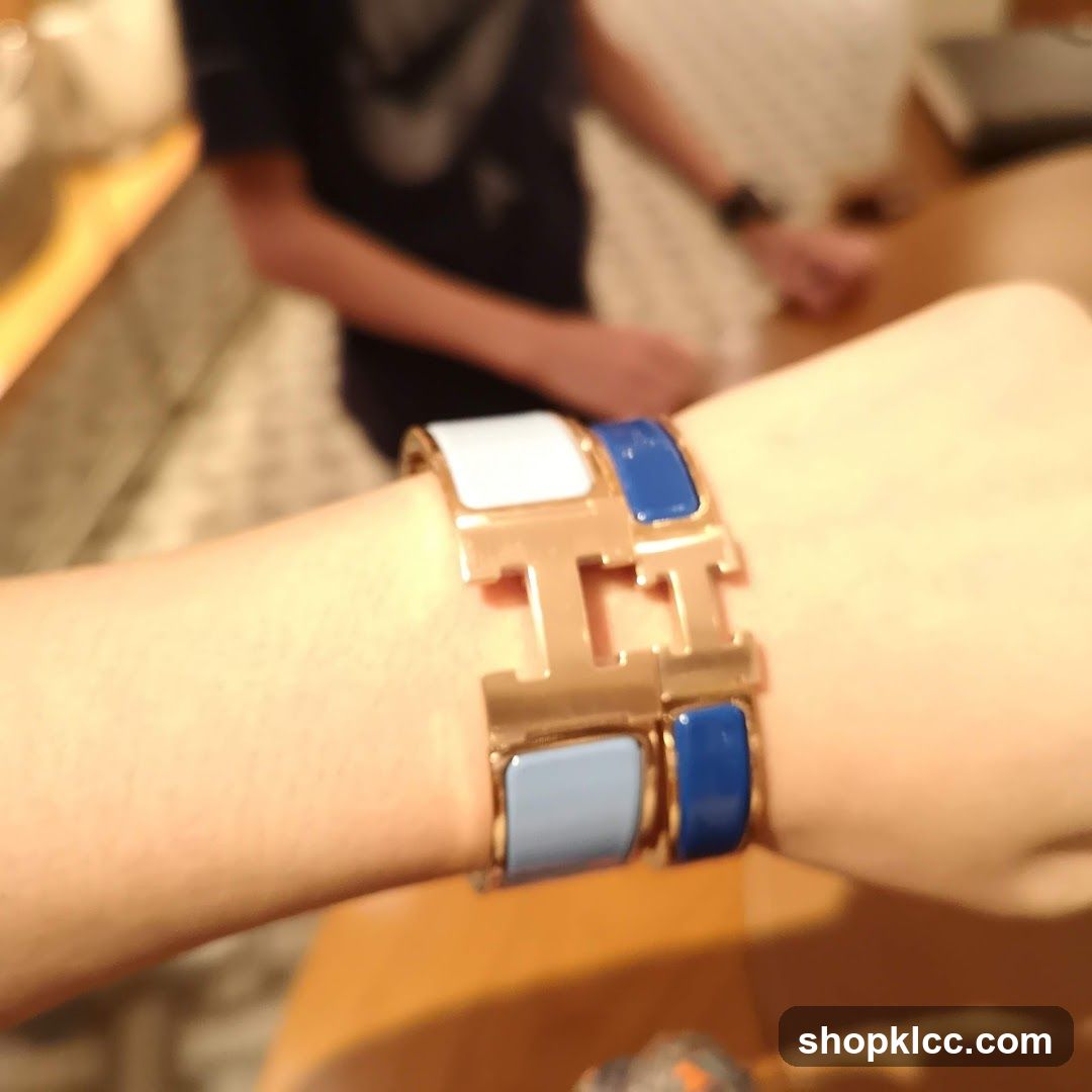 Hermes H-shaped bracelet on wrist