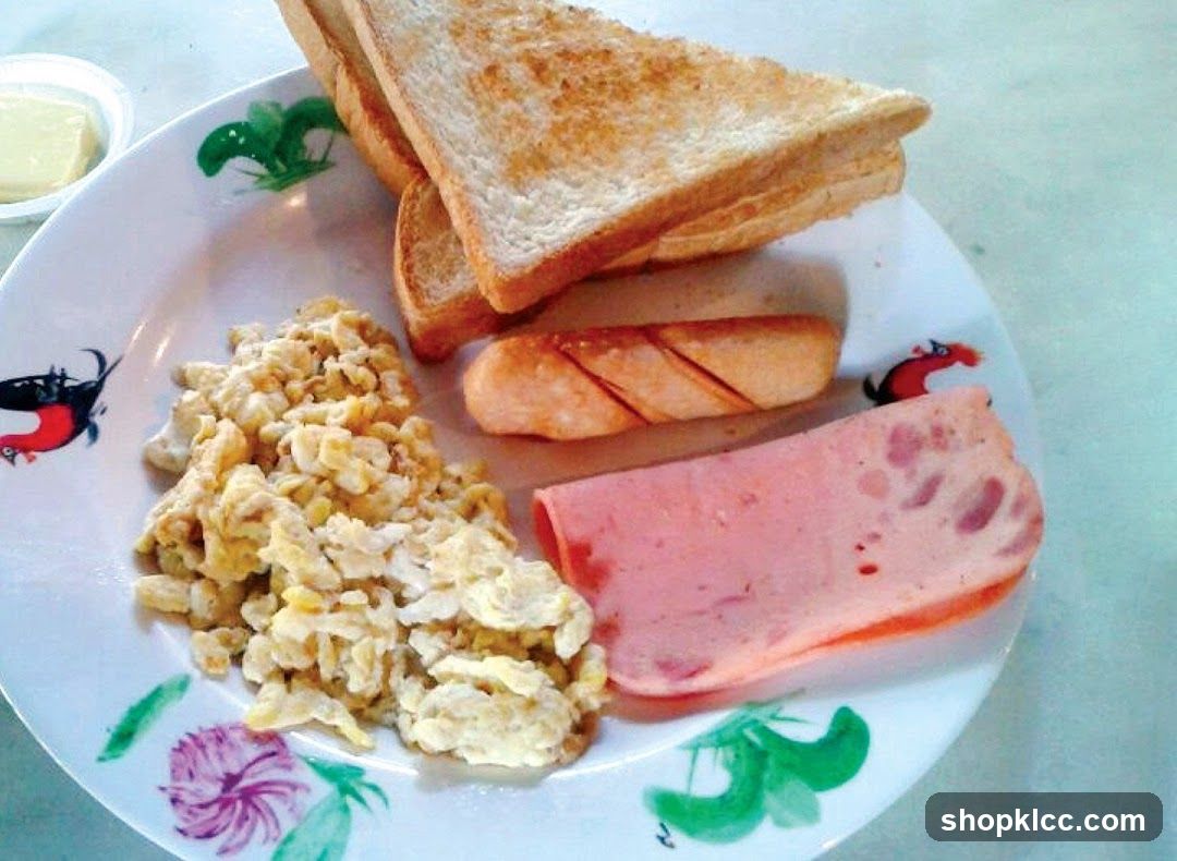 Breakfast Plate with Toast, Eggs, Sausage and Ham