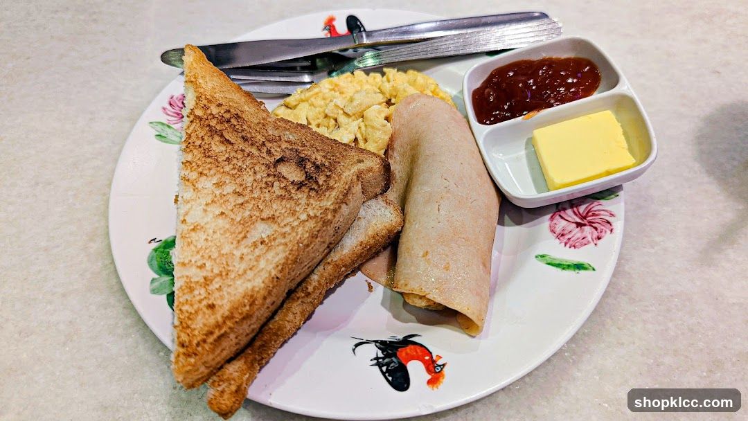 Breakfast Plate with Toast, Scrambled Eggs, and Rolls